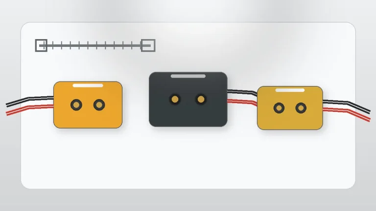 XT-style power connector housings and wire leads on an engineering workbench